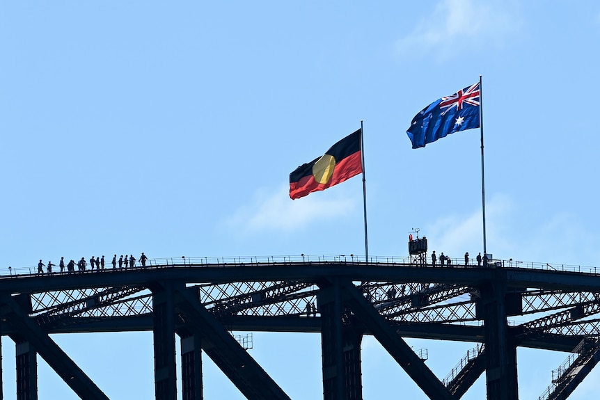The Aboriginal flag and the Australian flag on top of a large structure