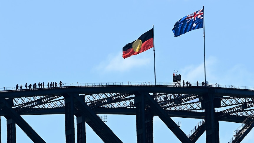 The Aboriginal flag and the Australian flag on top of a large structure