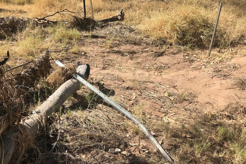 A fence, possibly damaged by heavy rainfall, at Trephina Gorge in Central Australia.