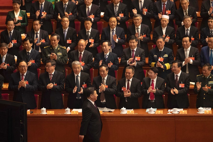 Chinese President Xi Jinping arrives for the opening session of the Chinese People's Political Consultative Conference.
