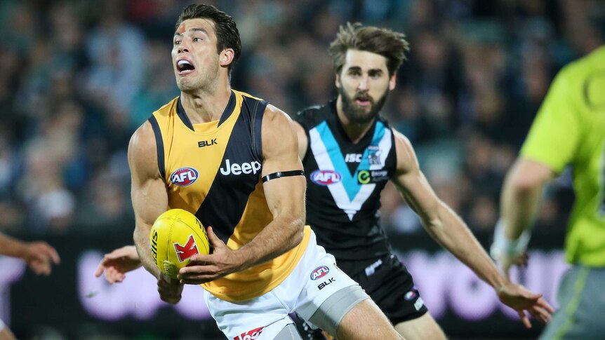 Richmond's Alex Rance looks to handball against Port Adelaide at Adelaide Oval.