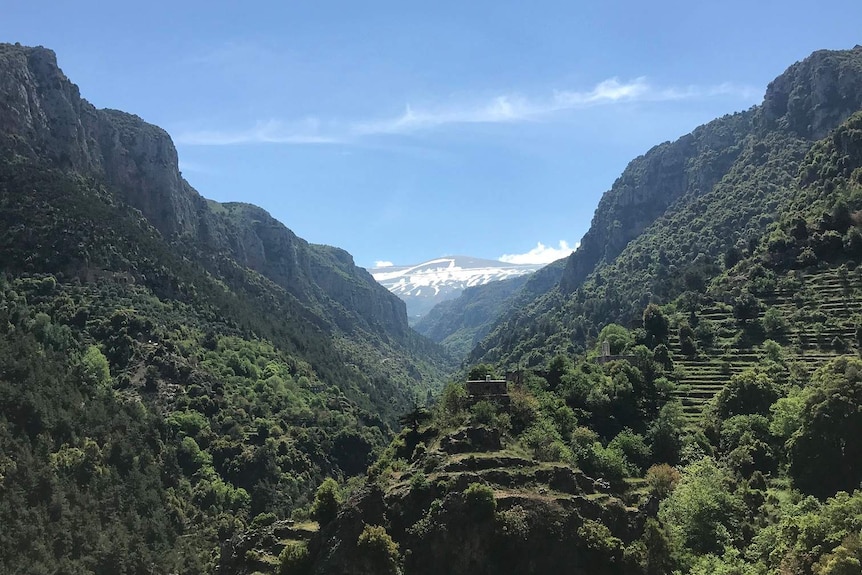 A dramatic view of mountains against a blue sky in Lebanon.