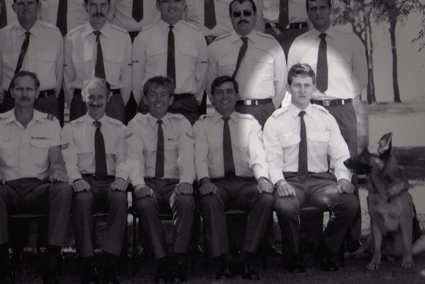 A group photo of Air Force personnel with one man highlighted