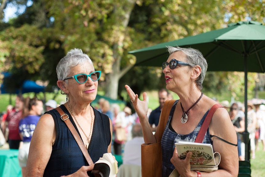 Sisters Libby Campbell and Juliet Gore animatedly discuss books at the Adelaide Writers' Festival