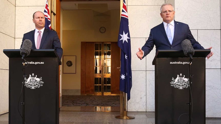 Wide shot of Scott Morrison and Josh Frydenberg speaking at podiums.