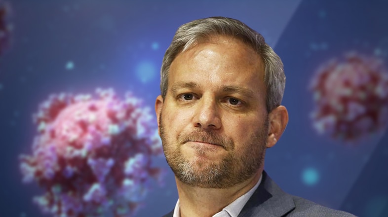 A graphic image of Chief Health Officer Brett Sutton in front of a coronavirus background.