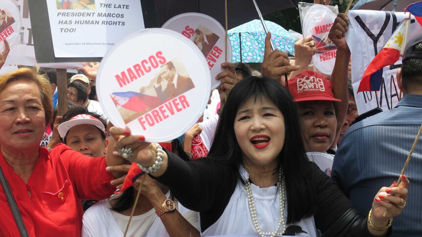 Pro-Marcos supporters rally outside the Supreme Court in Manila.