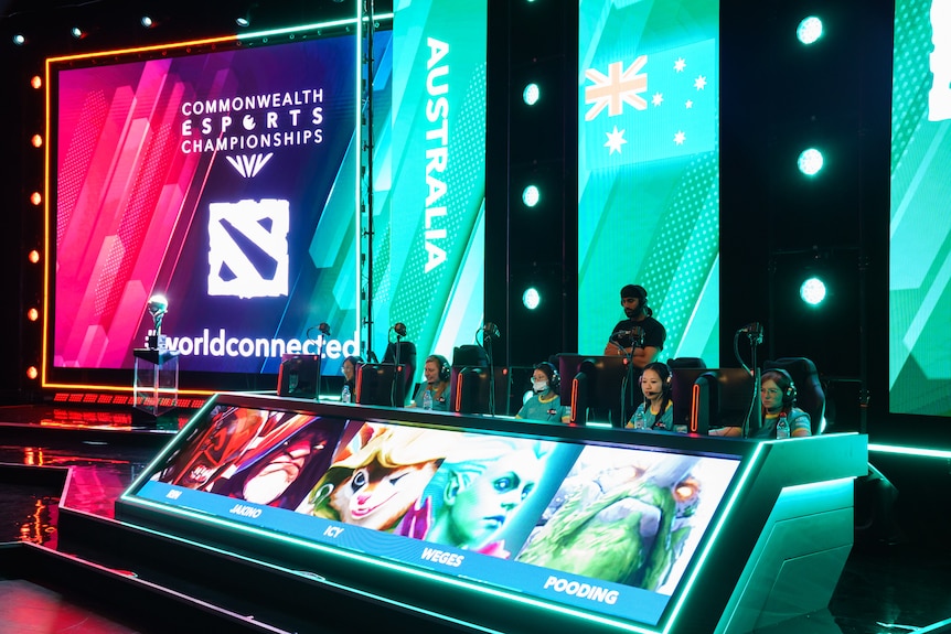 People sit behind character avatars at the Commonwealth Esports Championships.