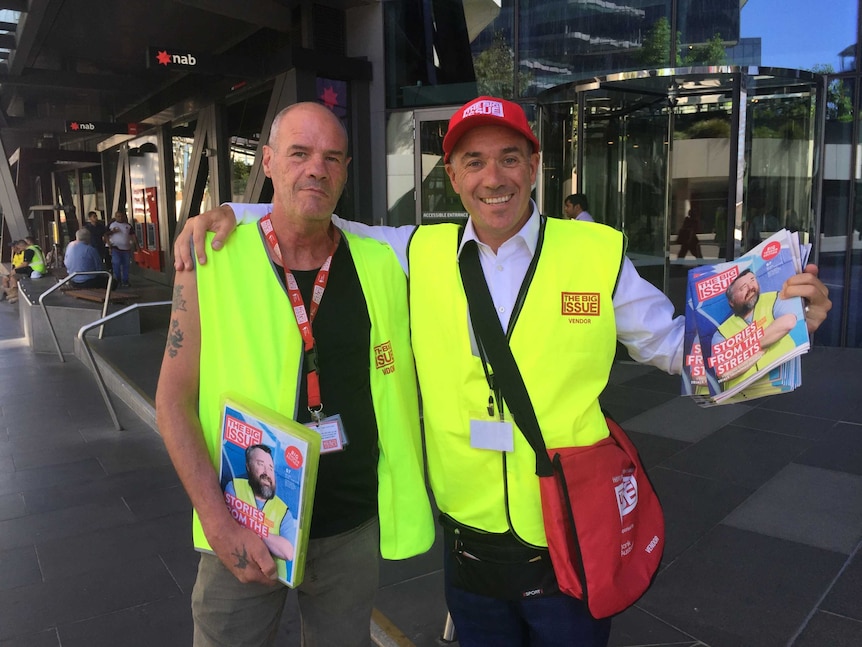 NAB boss Andrew Thorburn and Big Issue seller Allan Crabbe outside NAB's Melbourne HQ