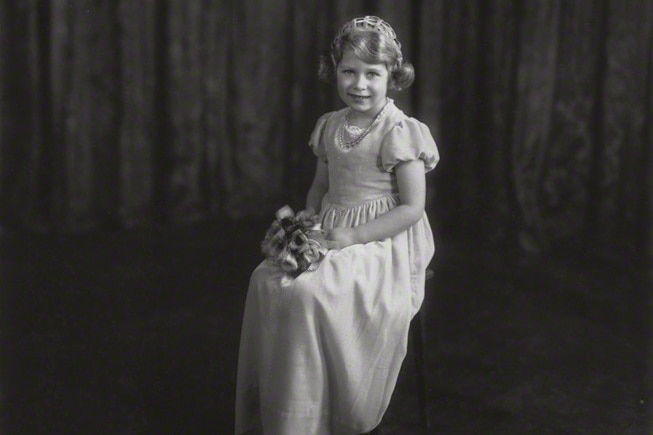 A portrait shows young Princess Elizabeth as a bridesmaid.