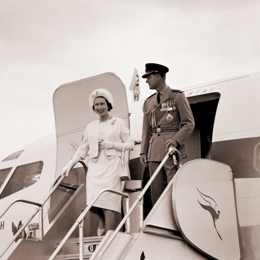The Queen and the Duke of Edinburgh wave as they step off a plane on their second visit to Australia in 1963.