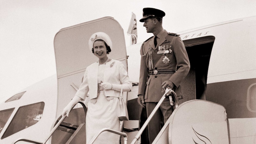The Queen and the Duke of Edinburgh wave as they step off a plane on their second visit to Australia in 1963.