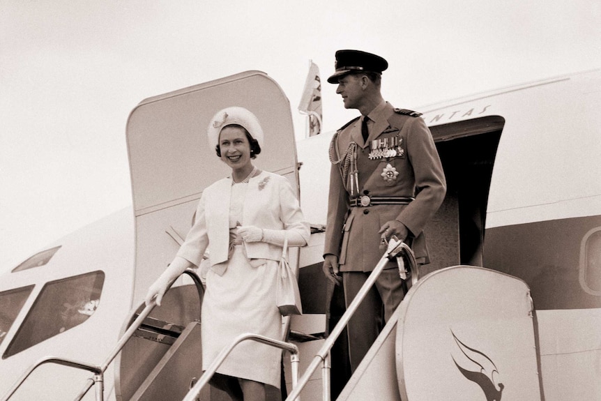 The Queen and the Duke of Edinburgh wave as they step off a plane on their second visit to Australia in 1963.