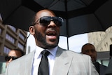 R Kelly leaves a criminal court in Chicago