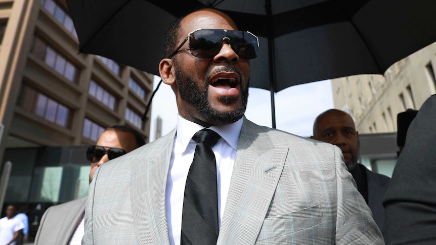 R Kelly leaves a criminal court in Chicago