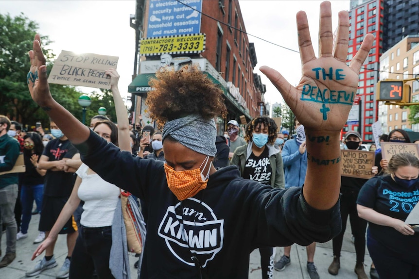 NYC protesters hands up marching