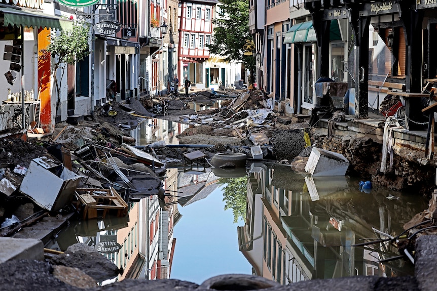 Water and mud sits in the town centre in Bad Muenstereifel, western Germany