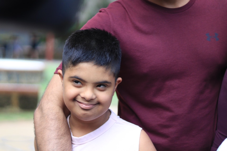 A young boy smiling. 