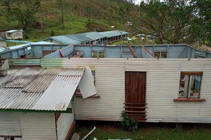 A house is seen without a roof in a rural area.