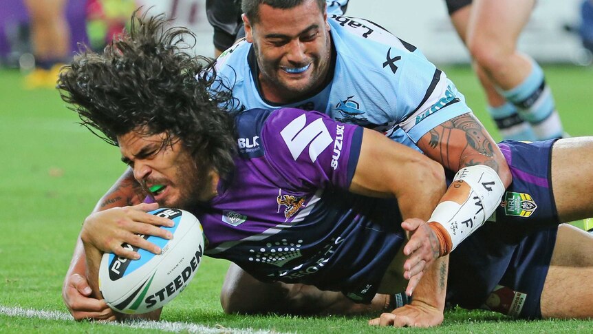 Tohu Harris of the Storm scores a try against Cronulla