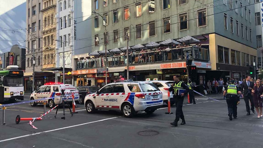 Paramedics attend the scene of an incident near Flinders Street Station in Melbourne.