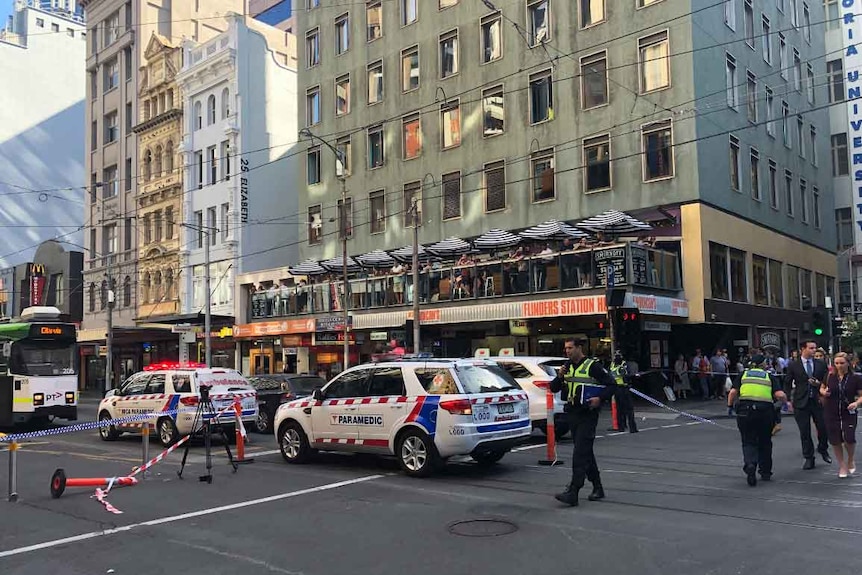 Paramedics attend the scene of an incident near Flinders Street Station in Melbourne.