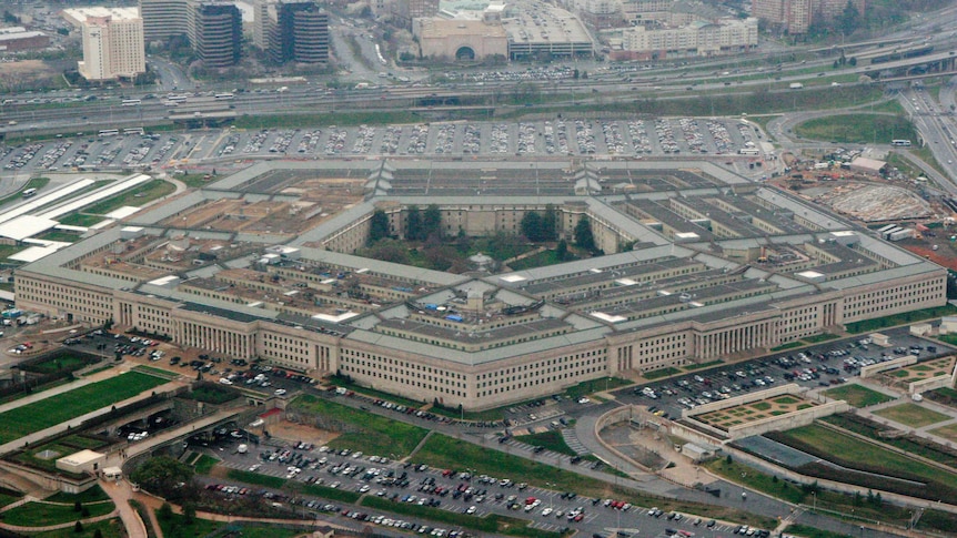 An aerial shot shows the five-sided Pentagon building sitting near a major highway.