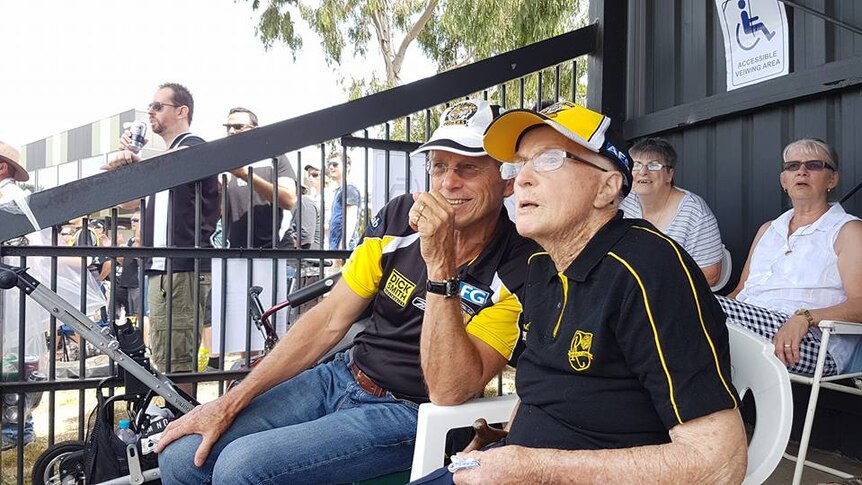 Richmond supporters Joyce Bond and Jeff Bond watch their team play in Moe, in Victoria's Latrobe Valley.