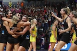 New Zealand's netball players celebrate on the court