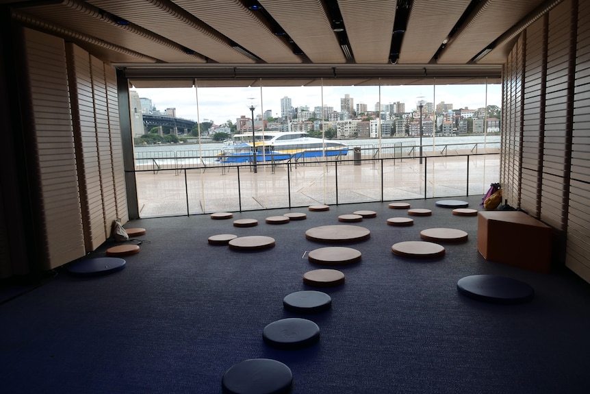 A ferry sails past the new space through the window