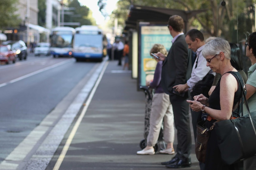 Woman waits for bus.