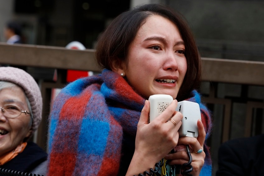 Freelance journalist Shiori Ito emotional outside court.
