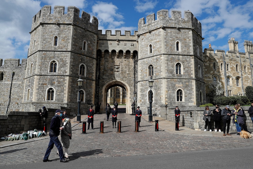 Windsor Castle wardens stand outside Windsor Castle following Prince Philip's death.
