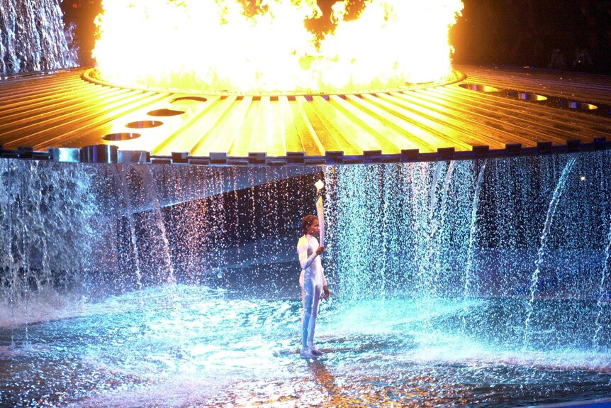 Cathy Freeman under the cauldron at the Sydney Olympics opening ceremony.