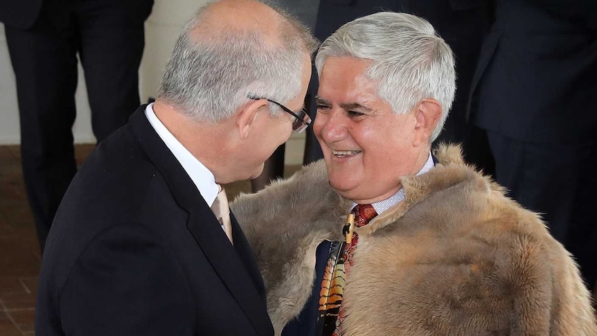 Scott Morrison and Ken Wyatt laugh as they stand outside Government House