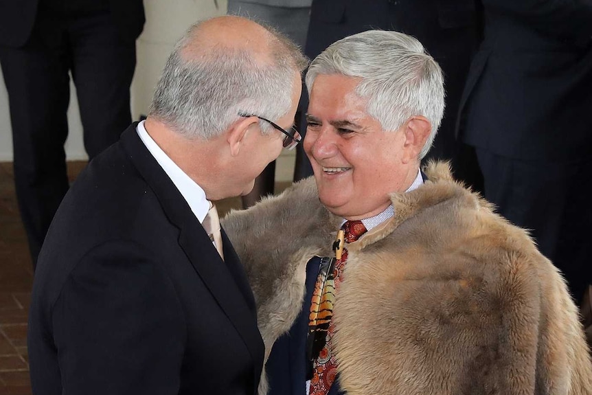 Scott Morrison and Ken Wyatt laugh as they stand outside Government House