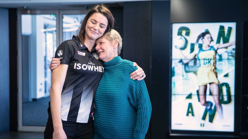 Sharni Layton hugs her mother at her retirement announcement.