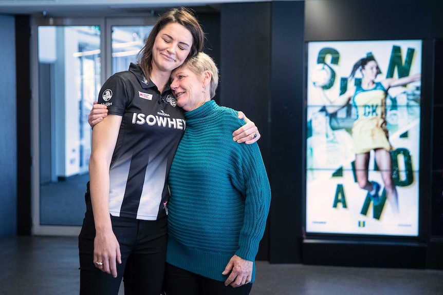 Sharni Layton hugs her mother at her retirement announcement.