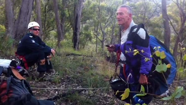 Paraglider stands on solid ground after seven hours stuck in tree