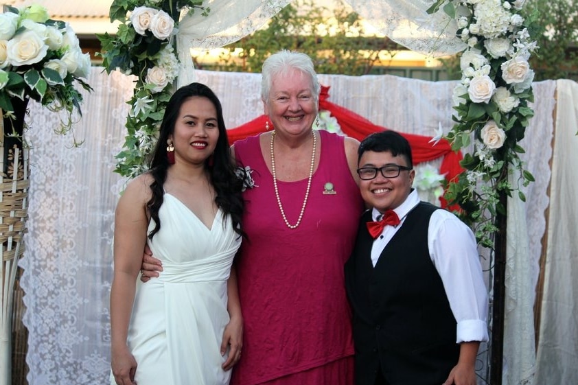 3 women at a wedding