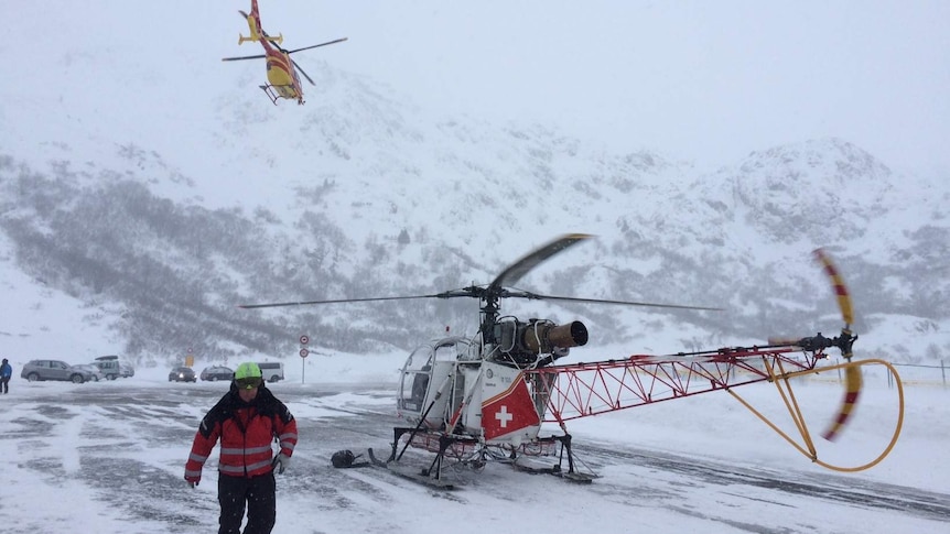 Rescue workers and helicopters take part in search for avalanche victims in Swiss Alps