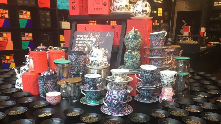 A variety of tea and tea cups and pots on display at a T2 store.