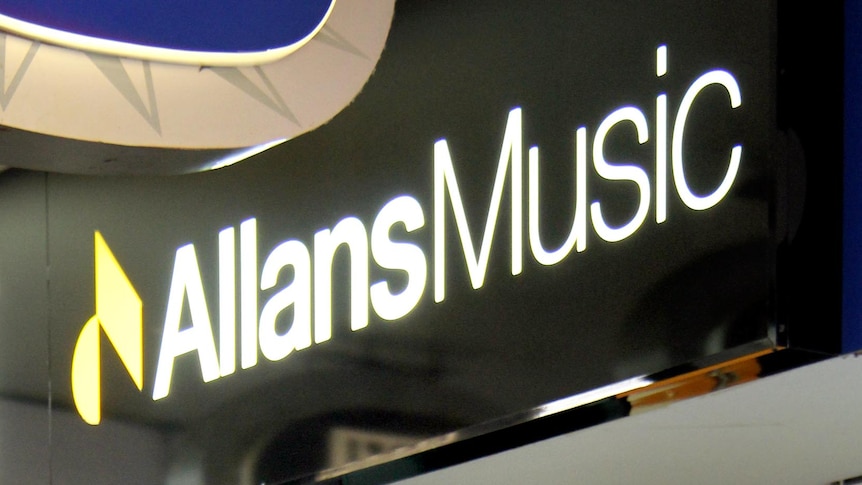 People walk past the Allans Music store entrance in the Queen Street Mall.