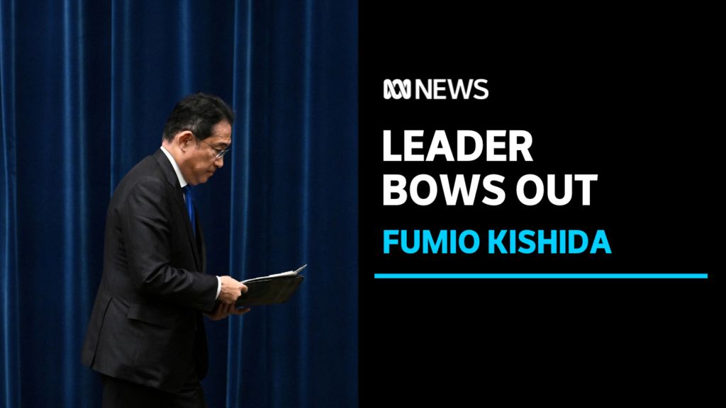 Leader Bows Out, Fumio Kishida: A man in a suit and tie walks left to right across the shot holding documents.