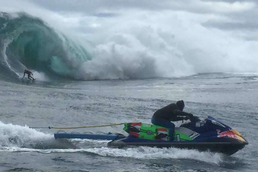 A surfer rides one of the waves at Shipstern Bluff