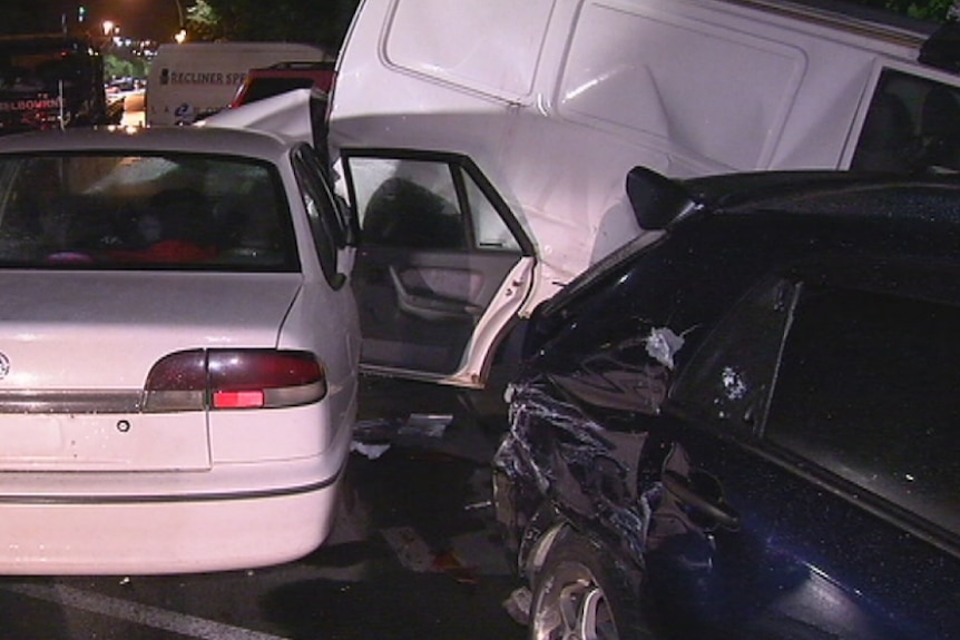 A man is under police guard in hospital after crashing his car into several other vehicles.