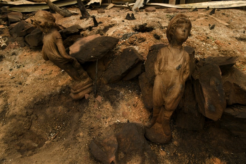 Burnt remains are seen as Prime Minister Scott Morrison tours the property of John 'Kooka' Kinniburgh.