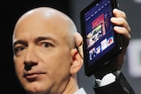Amazon founder Jeff Bezos holds the new Amazon tablet called the Kindle Fire on September 28, 2011 in New York City.