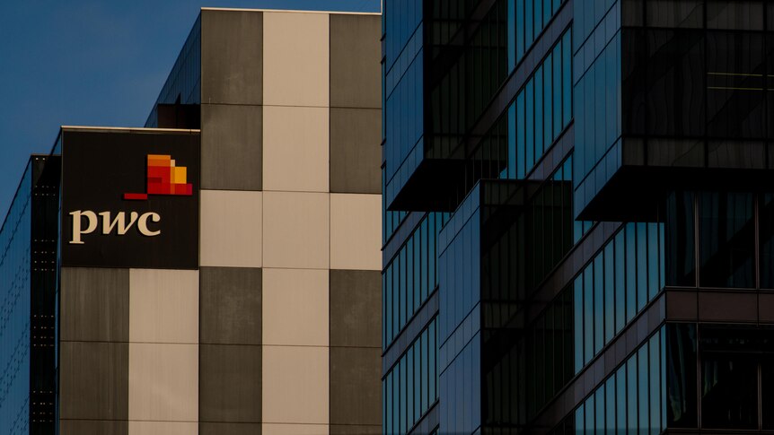 A sign saying pwc on an office building