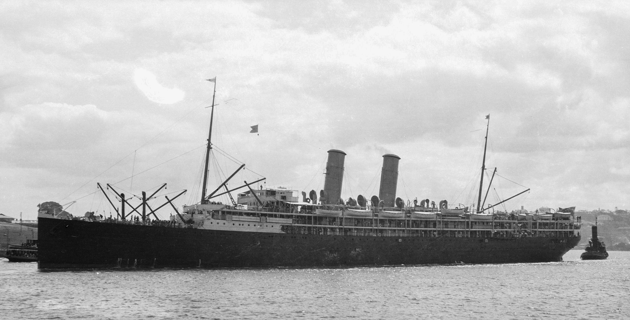 A large ship in old Sydney Harbour